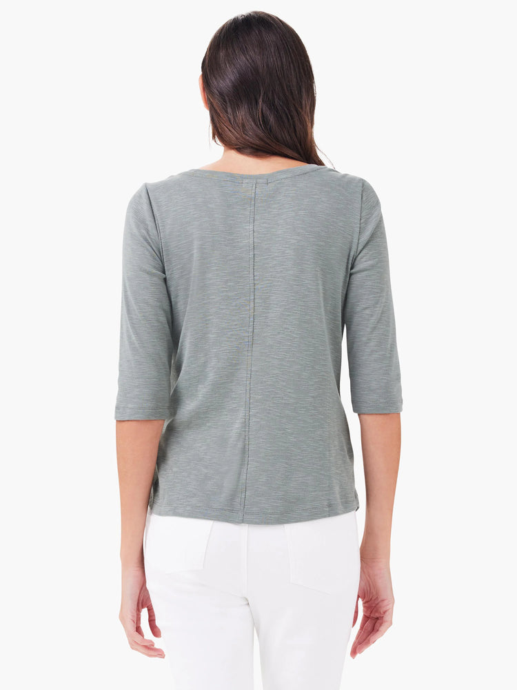 Muted greenish-gray 3/4 sleeve boat tee, back view on model. Features a center back seam and textured fabric.