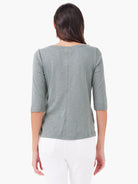 Back view: heather grey-green 3/4 sleeve tee with marled texture and a vertical seam down the center.