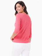 Coral 3/4 sleeve boat neck tee with a heathered texture and vertical seam on the back.