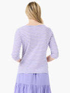 Here's alt text that meets the requirements:

Lilac and white striped 3/4 sleeve boatneck shirt.