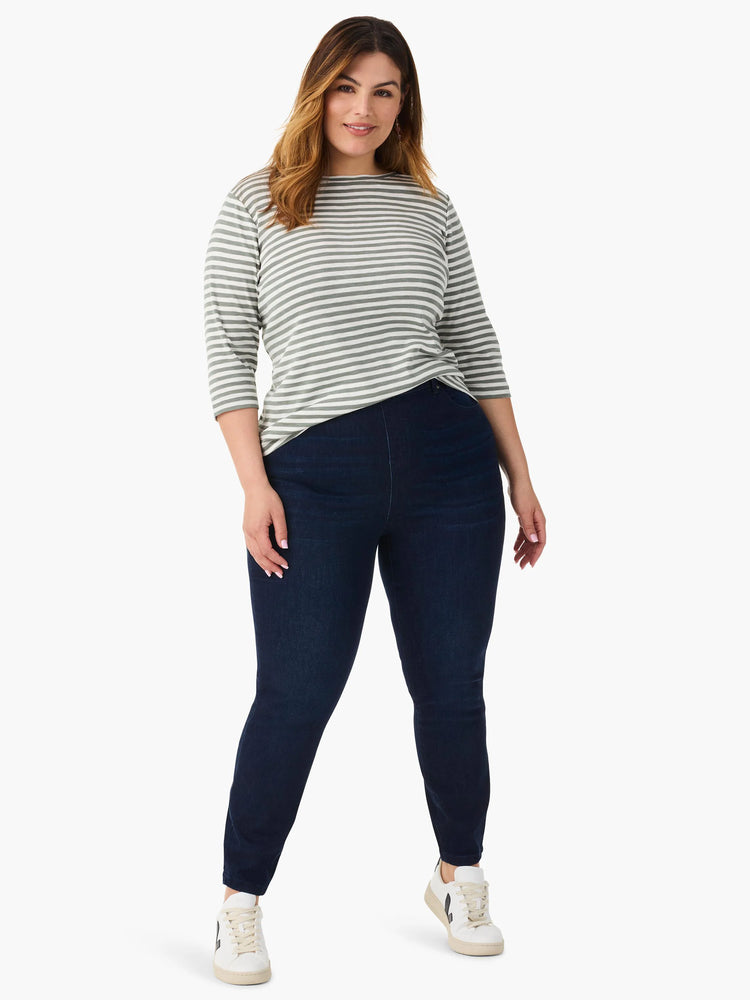 Model wears an off-white and muted green striped 3/4 sleeve boat neck tee.