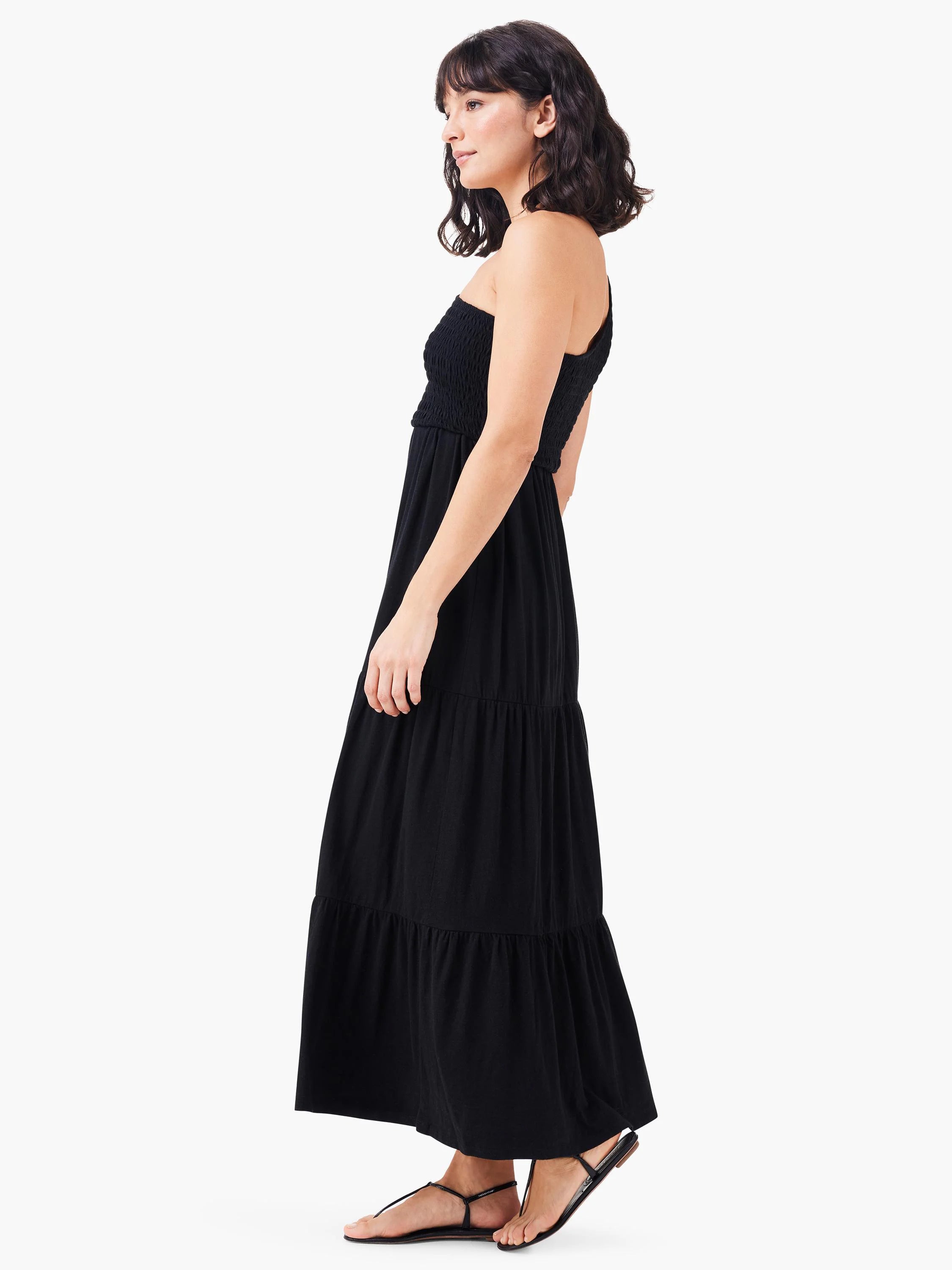 Black smocked one-shoulder maxi dress with tiered skirt.