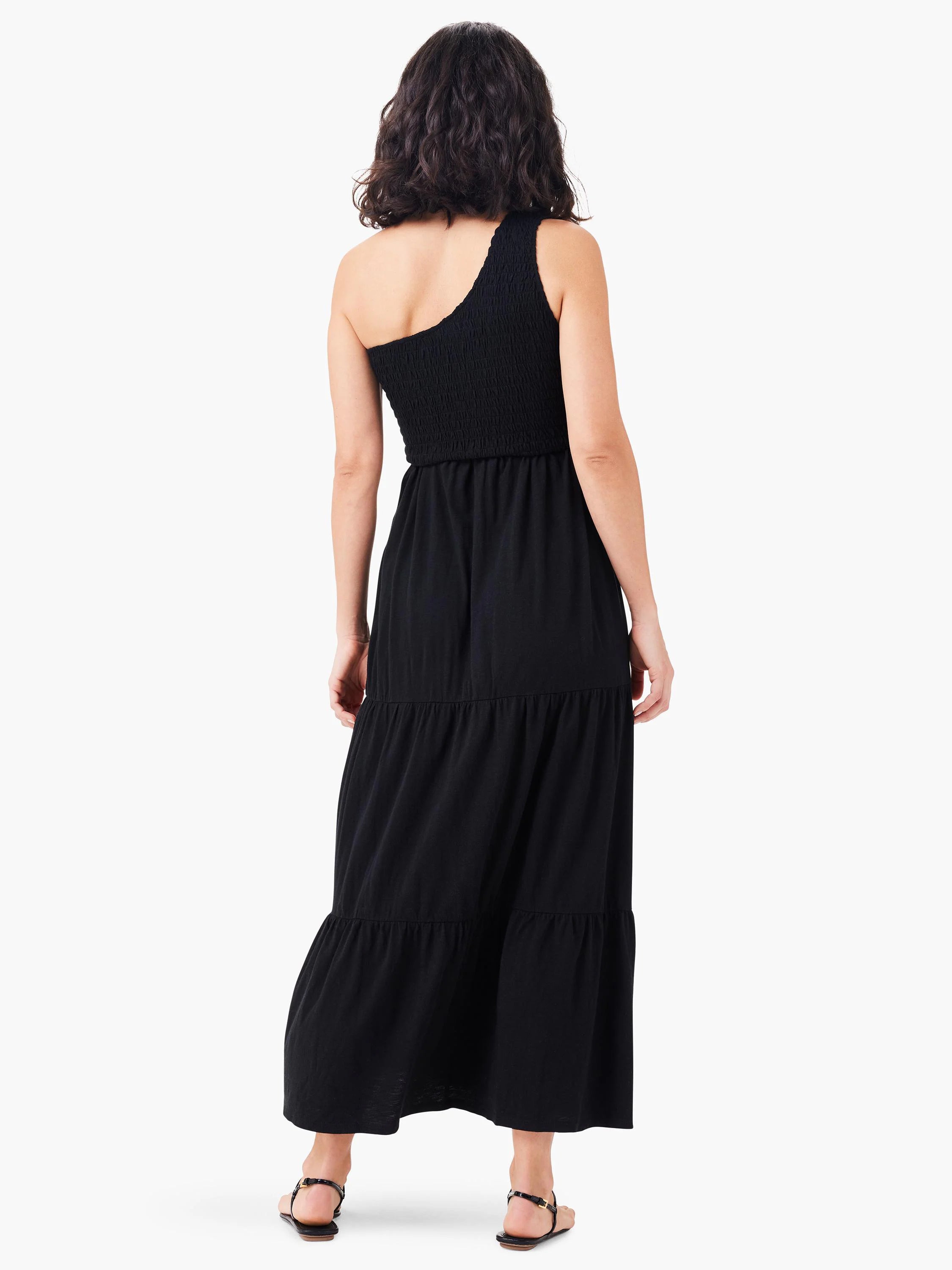 Black tiered maxi dress; one-shoulder neckline, smocked bodice.