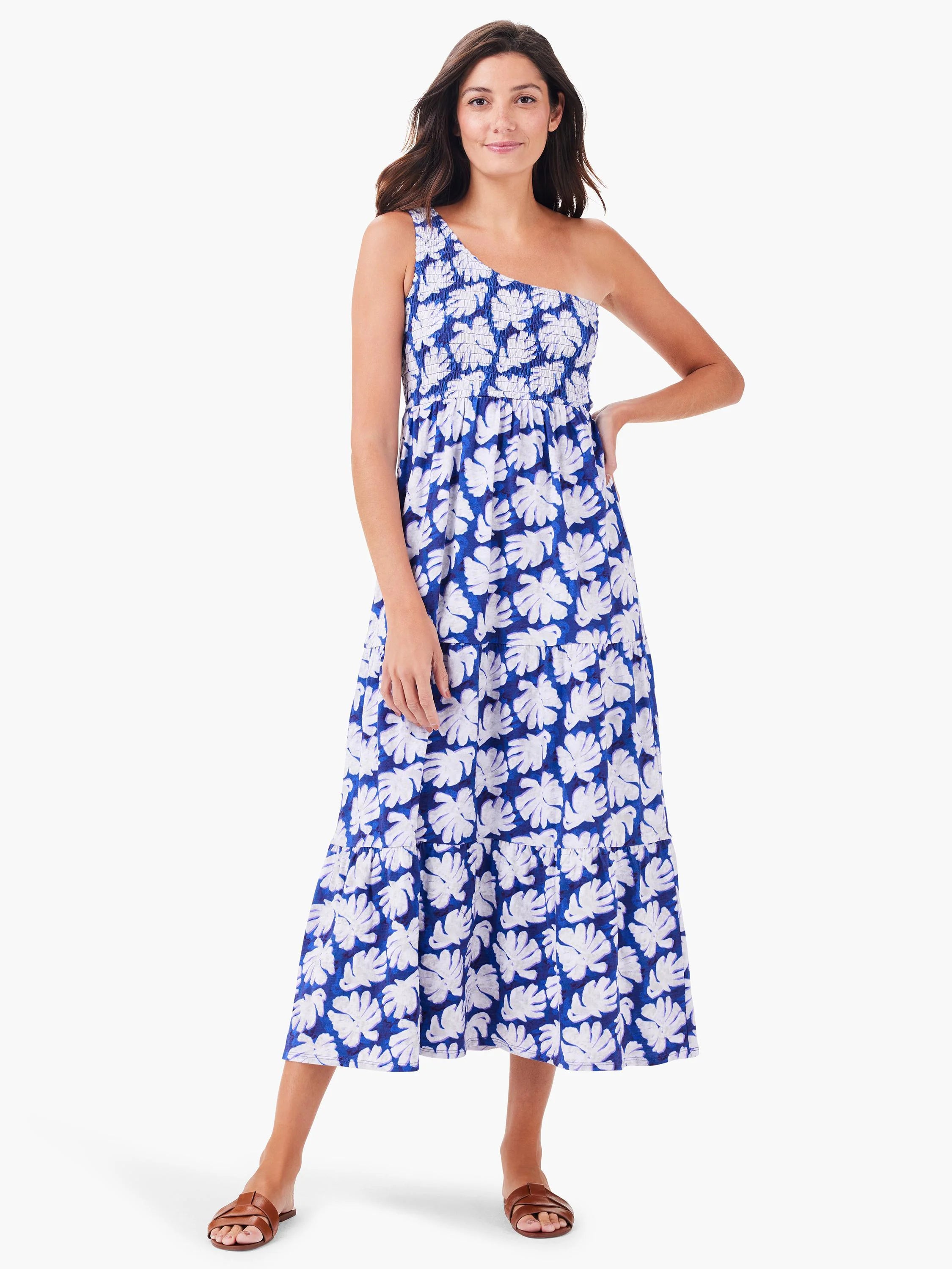 One-shoulder, smocked bodice midi dress. Blue background with white leaf print.  Tiered skirt.
