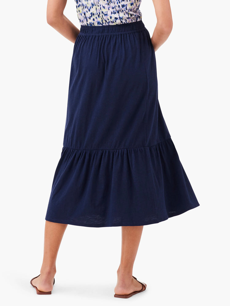 Navy blue tiered midi skirt; elastic waistband.