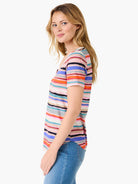 Short-sleeved, V-neck tee with multicolored horizontal stripes.  Colors include pink, orange, blue, teal, and gray.