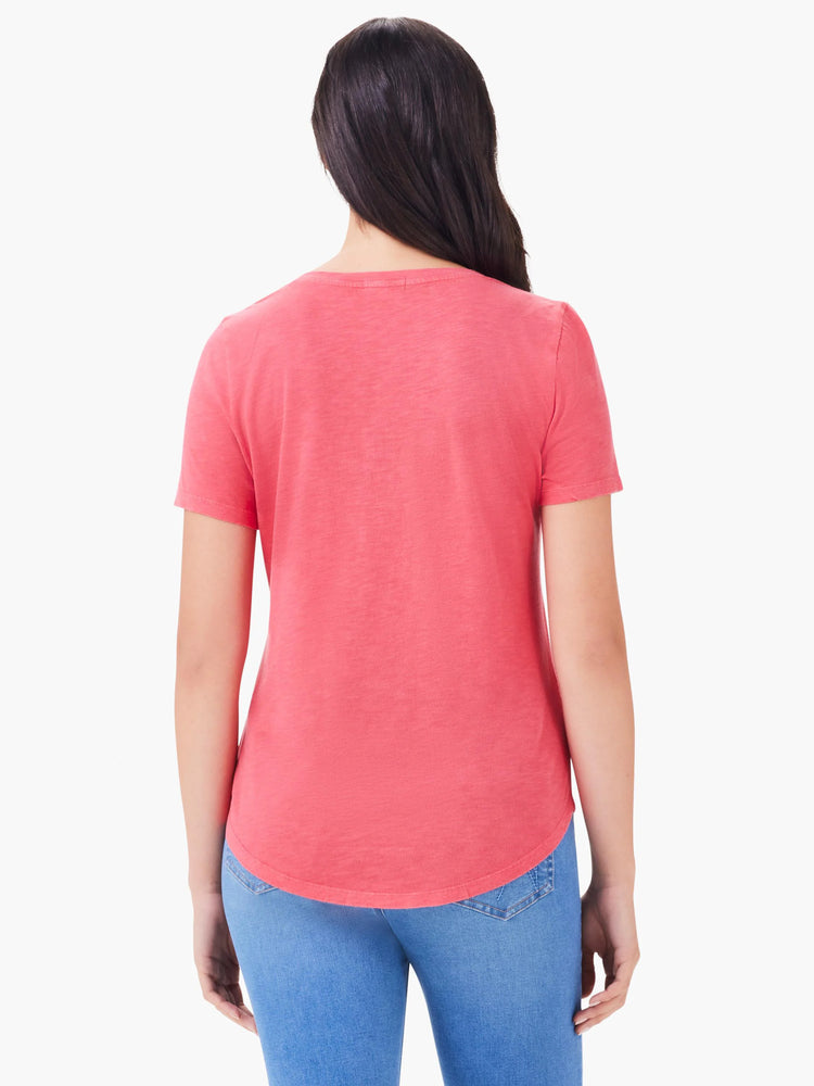 Back view of a person wearing a faded coral short-sleeve tee with a curved hem.