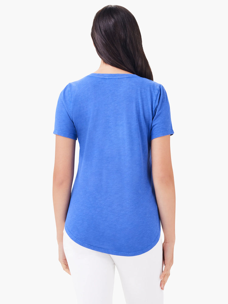 Blue short sleeve V-neck tee, worn from the back. Features a rounded hem and subtle heathered fabric texture.