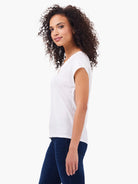 White v-neck, short-sleeve cotton tank top shown on model.