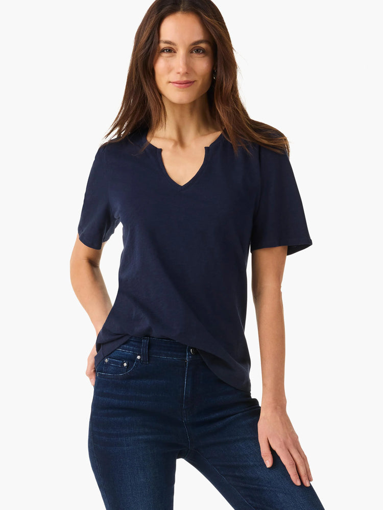 Navy blue short-sleeve tee with a split V-neck.  The model is wearing dark wash jeans.