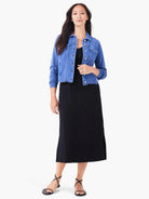 Cropped medium blue denim-look jacket with silver buttons and chest pockets.