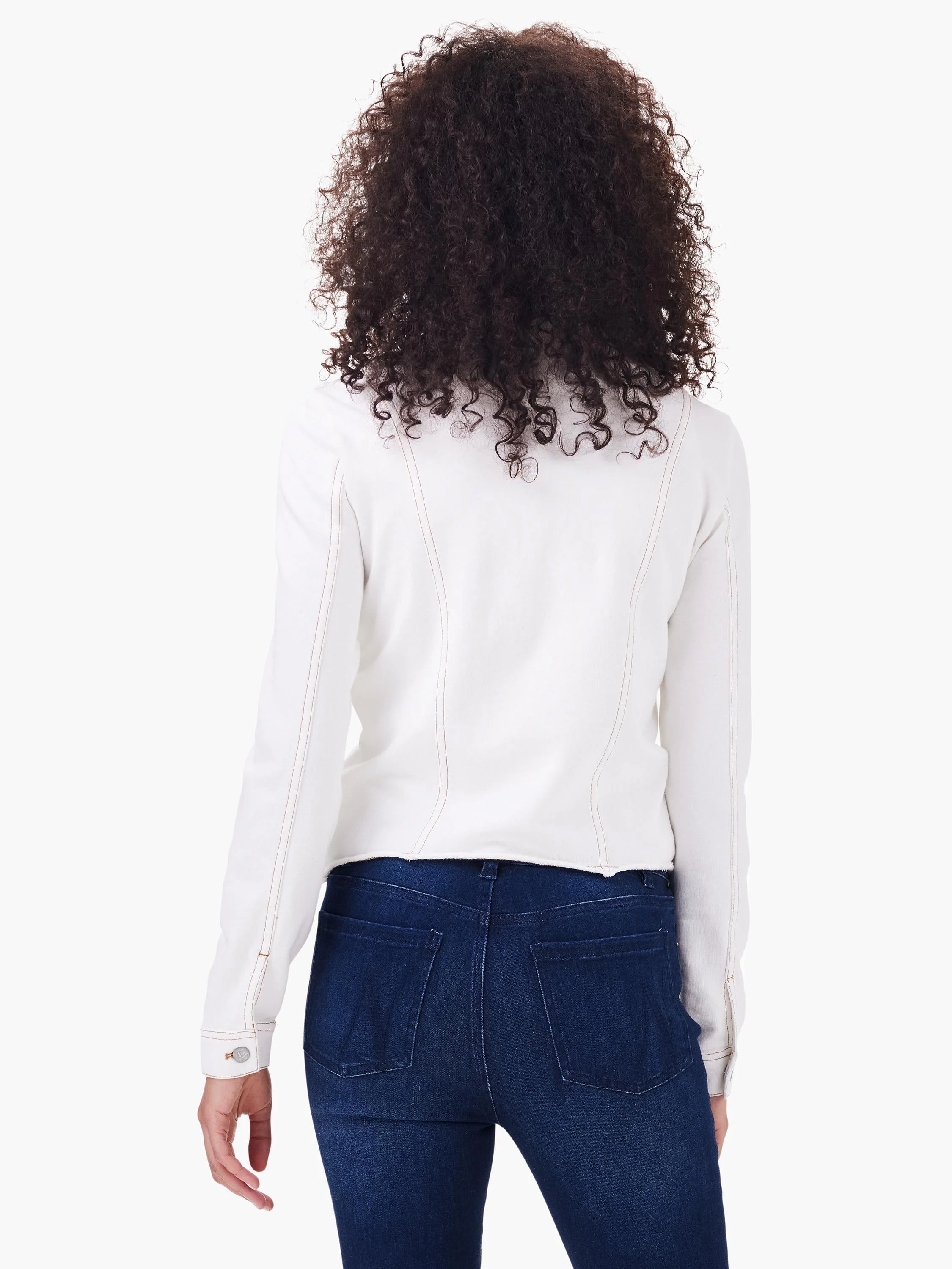 A cream jacket with denim-style tan contrast stitching, tailored seams, and a raw hem, shown from the back.