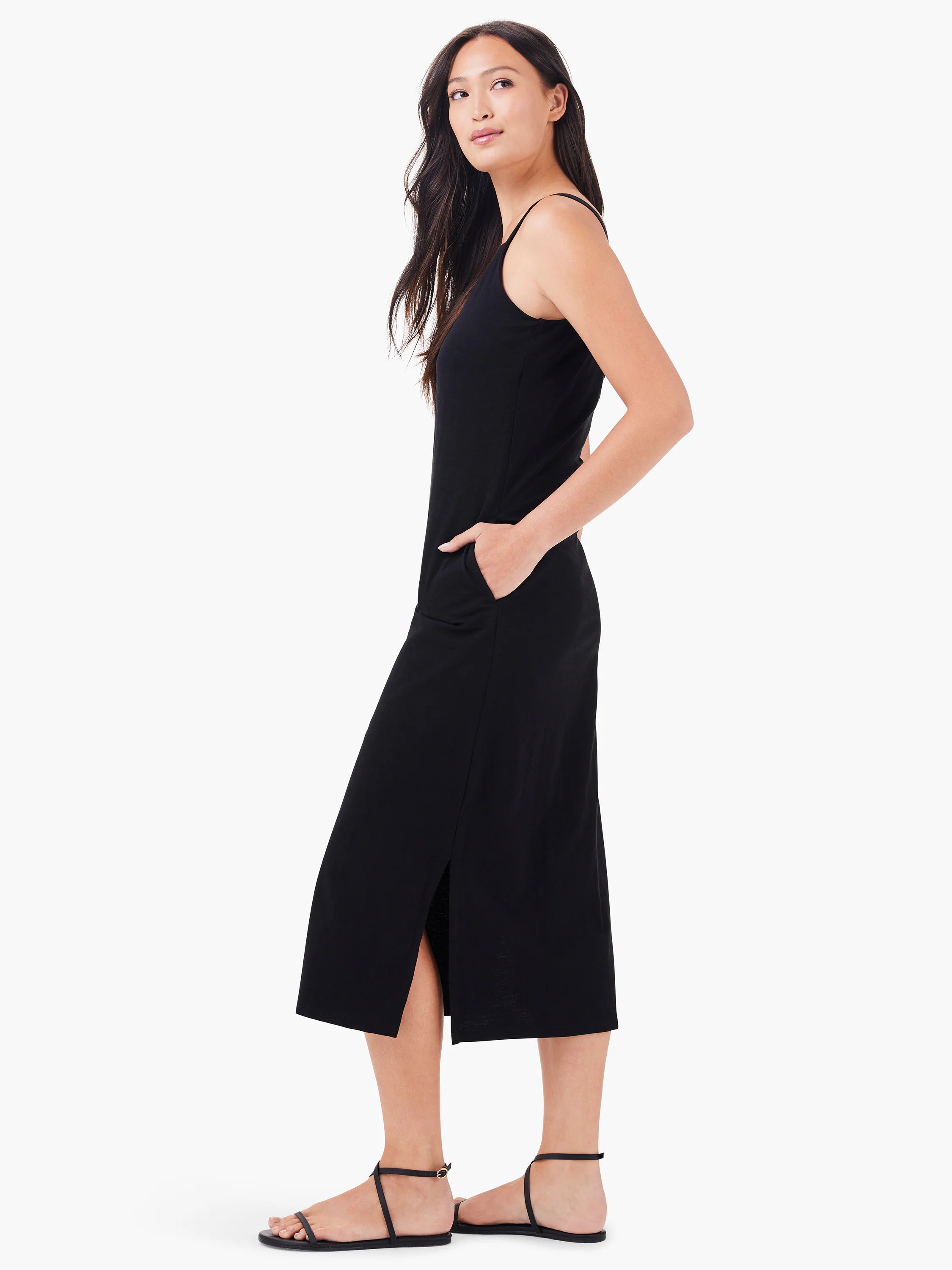 Black midi tank dress with thin straps and side slit.