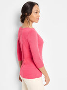 Model wears a bright pink heathered boat neck tee with 3/4 sleeves.