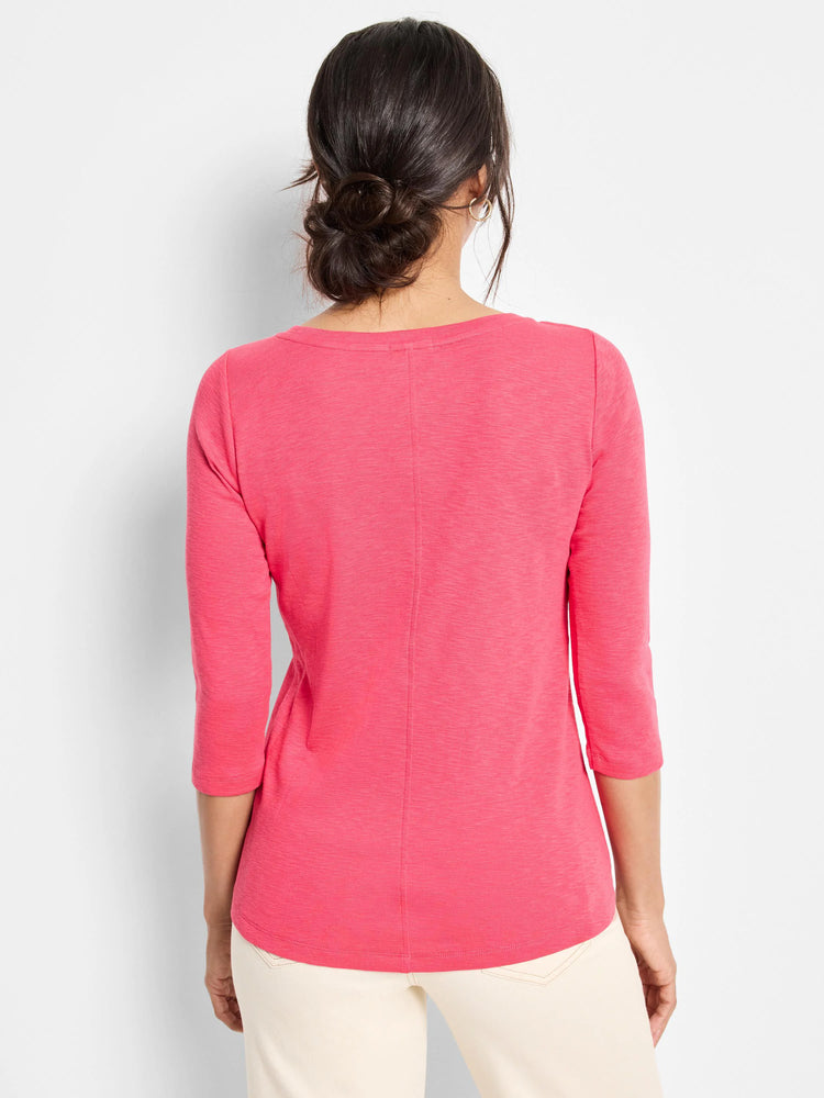 Bright pink 3/4 sleeve boat tee, back view. Features a textured knit, center back seam, and curved hem.