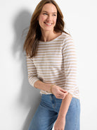 White and beige horizontal striped boat neck tee with 3/4 length sleeves.