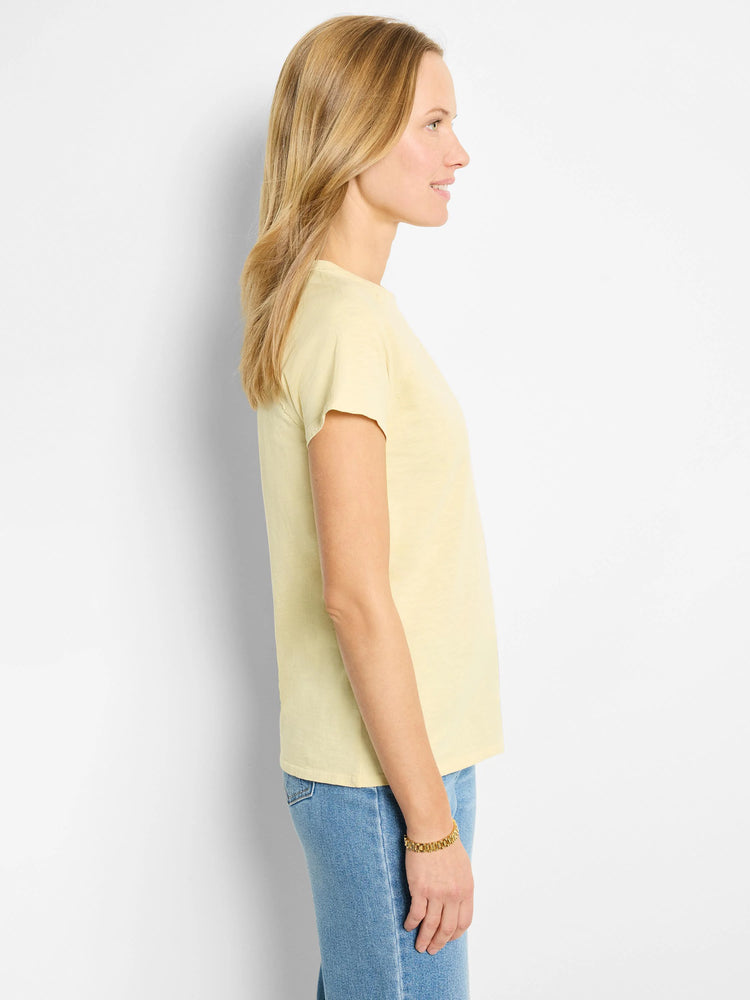 Pale yellow short-sleeve crew neck t-shirt.  Side profile view.