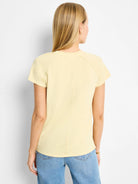 Pale yellow, short-sleeved crew neck cotton t-shirt.  Raglan sleeves.