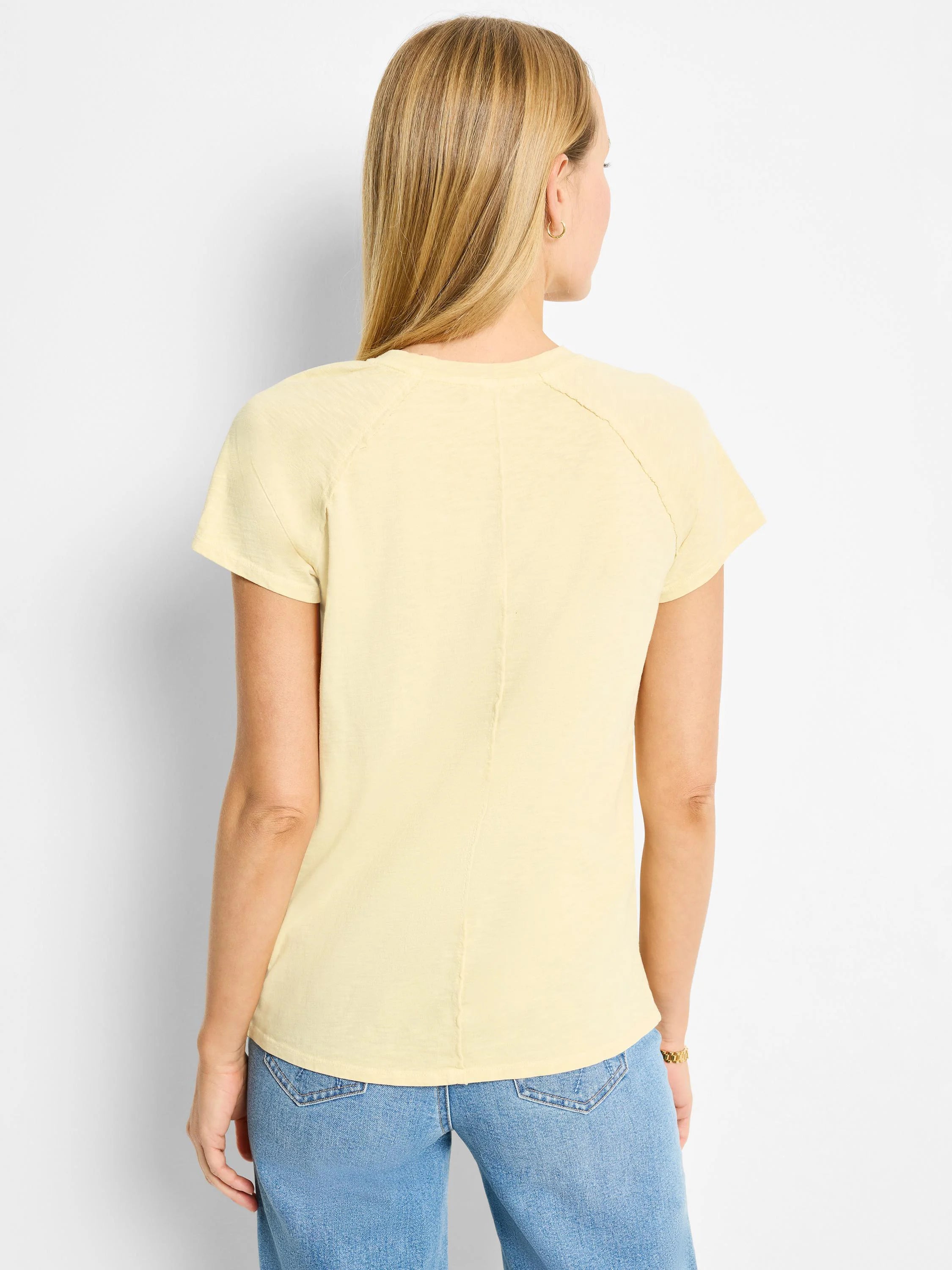 Pale yellow, short-sleeved crew neck cotton t-shirt.  Raglan sleeves.