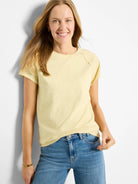 Pale yellow cotton crew neck tee with short sleeves and slightly dropped shoulders.