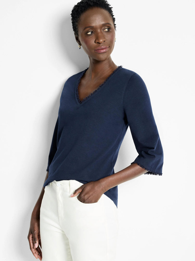 Navy blue, 3/4 sleeve shirt.  V-neck with frayed trim detail at neckline and sleeves.