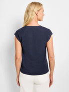 Navy blue tank top with rounded back neckline and cap sleeves, worn by a woman facing away.