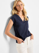 Dark blue V-neck tank with short sleeves, featuring a relaxed fit.