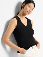 Black ribbed sleeveless V-neck tank top.