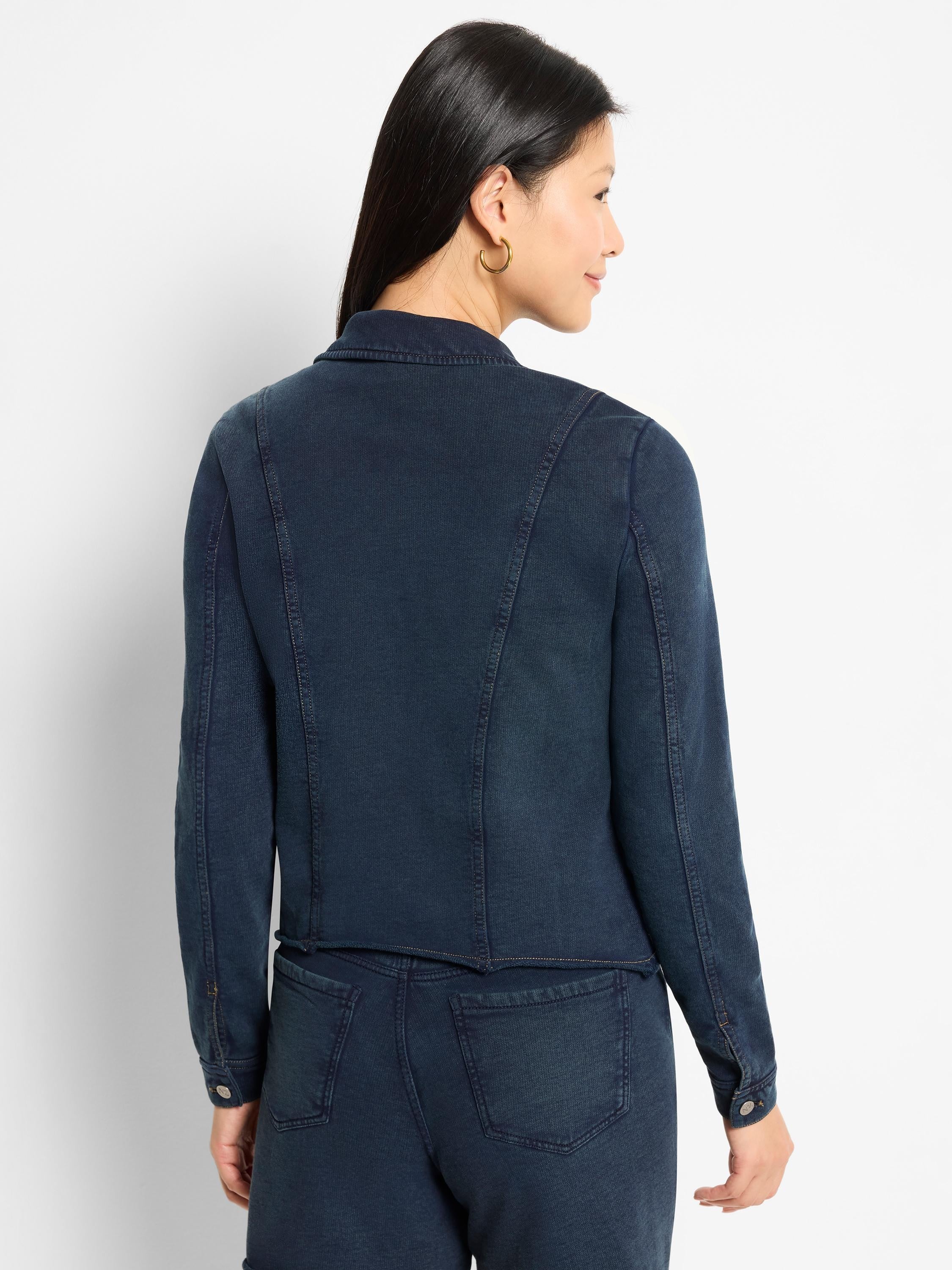 Dark indigo jacket, subtle vertical ribbing. Collar, long sleeves, and prominent back panel seaming details.