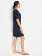 Navy blue short-sleeved dress; ruched elbow-length sleeves.  A-line silhouette.