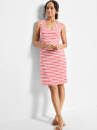 Pink and white striped sleeveless V-neck dress; knee-length.