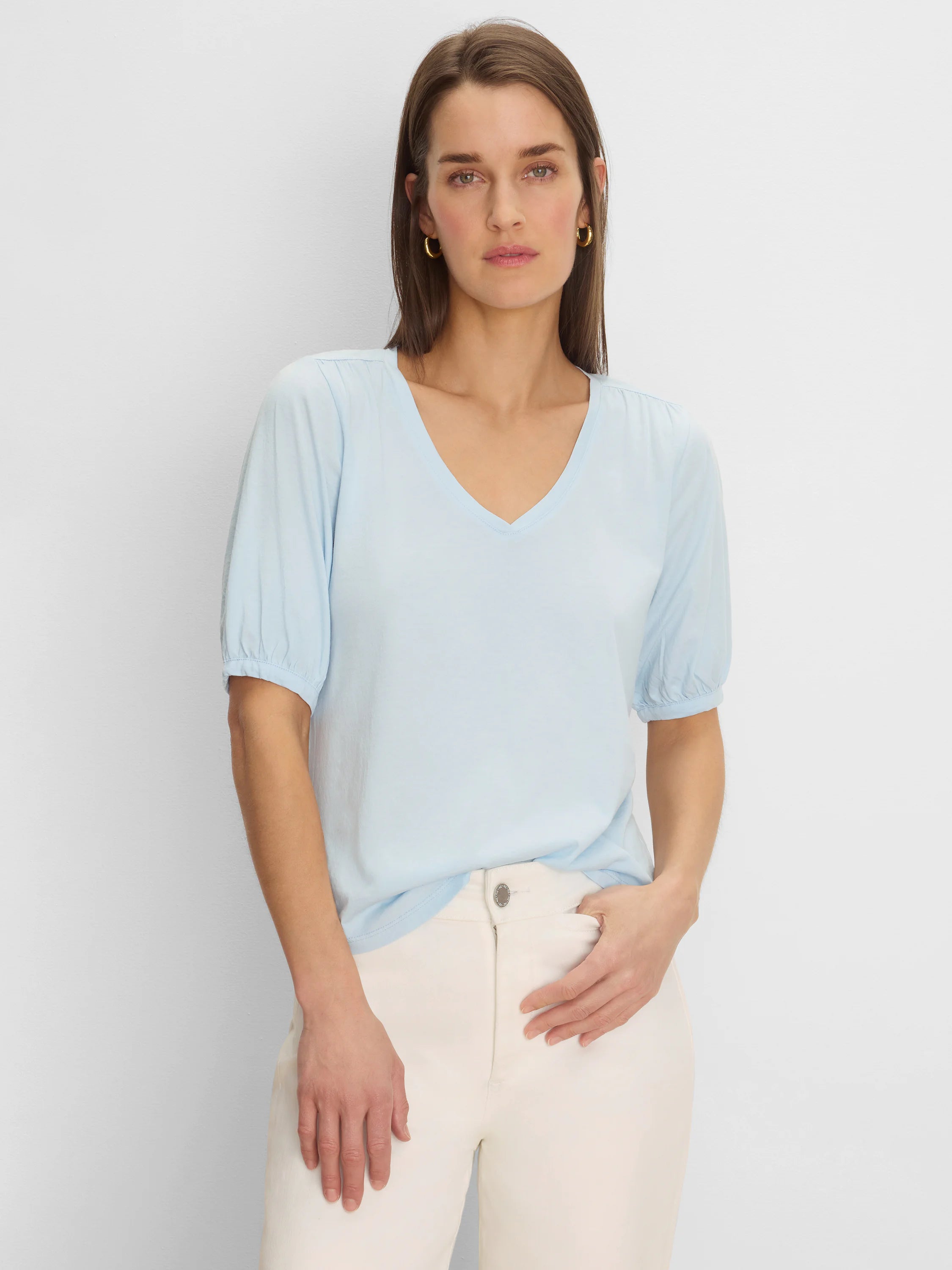 Light blue V-neck tee with elbow-length sleeves, gathered at shoulders and cuffs.