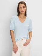 Light blue V-neck tee with elbow-length sleeves and gathered cuffs.