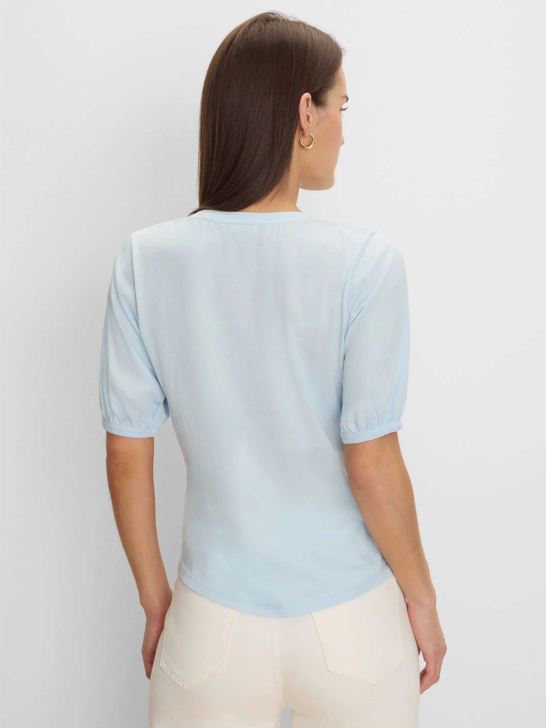 Light blue elbow-sleeve tee, back view on model. Features gathered cuffs and a rounded back neckline.