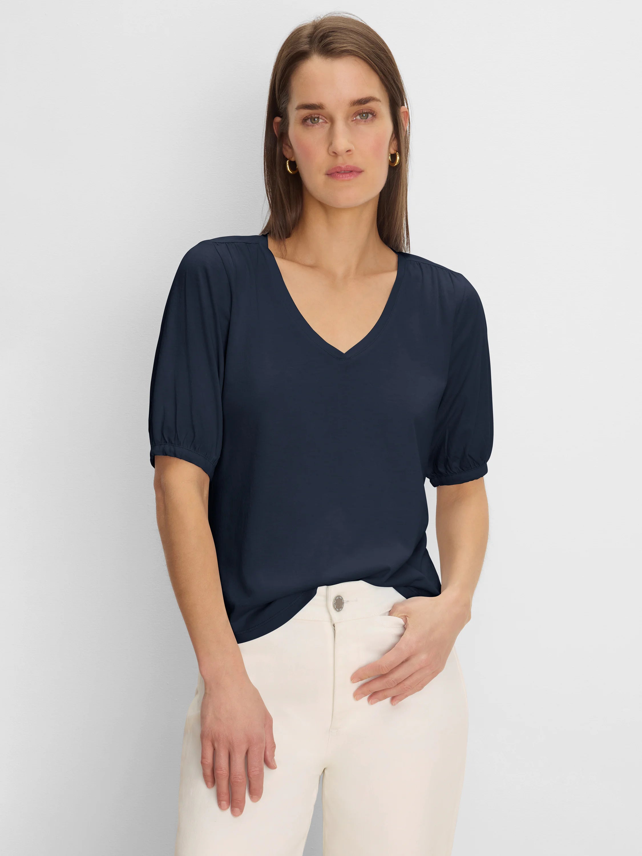 Navy V-neck tee with gathered elbow sleeves.