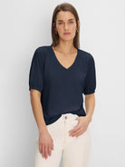 Navy V-neck tee with elbow-length sleeves, gathered at the shoulders.