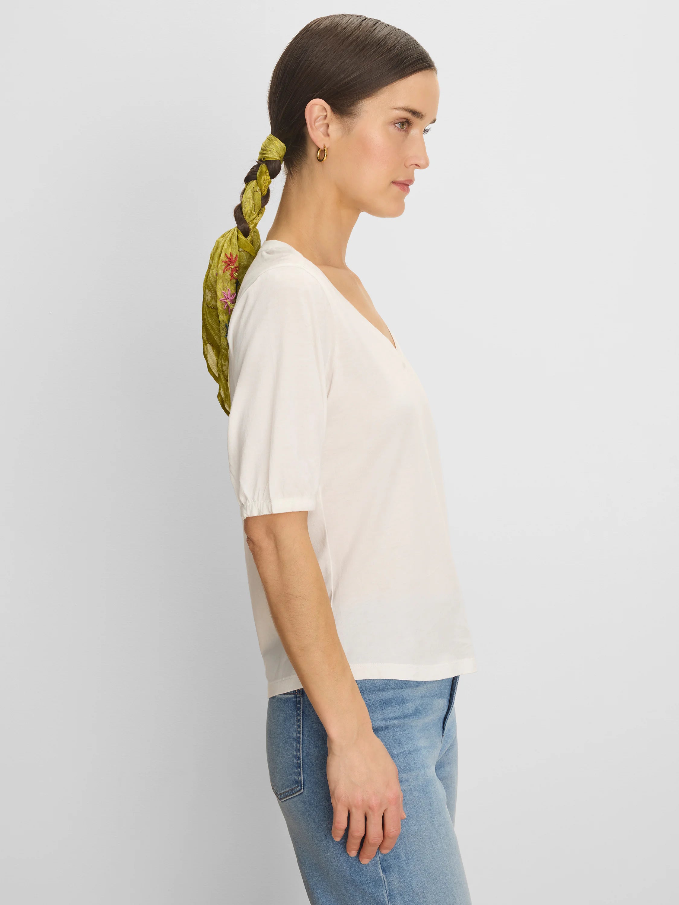 Cream V-neck tee with elbow-length gathered sleeves.