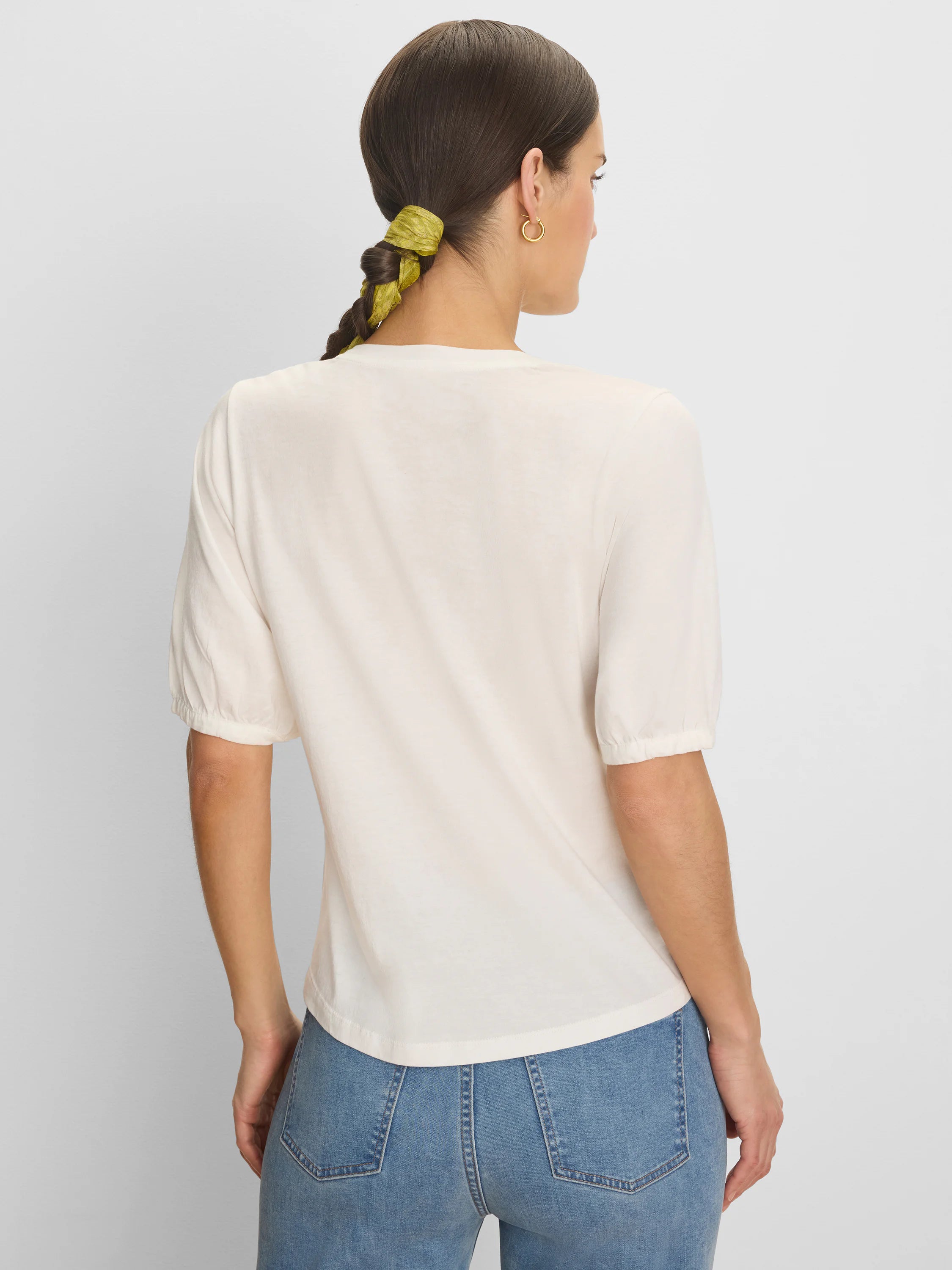 Cream elbow-sleeve tee with gathered cuffs, shown from the back.