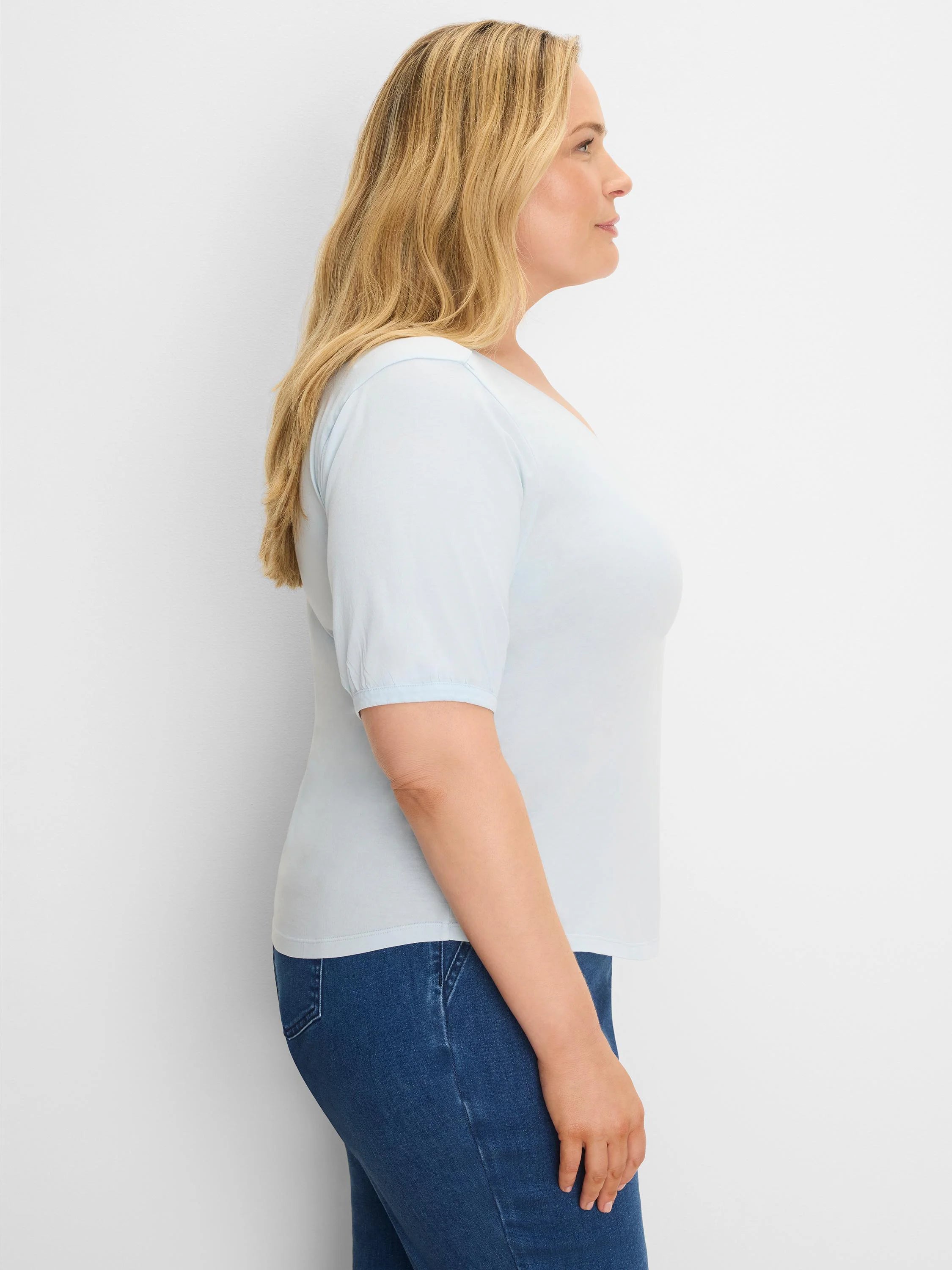 Light blue V-neck tee with elbow-length sleeves.