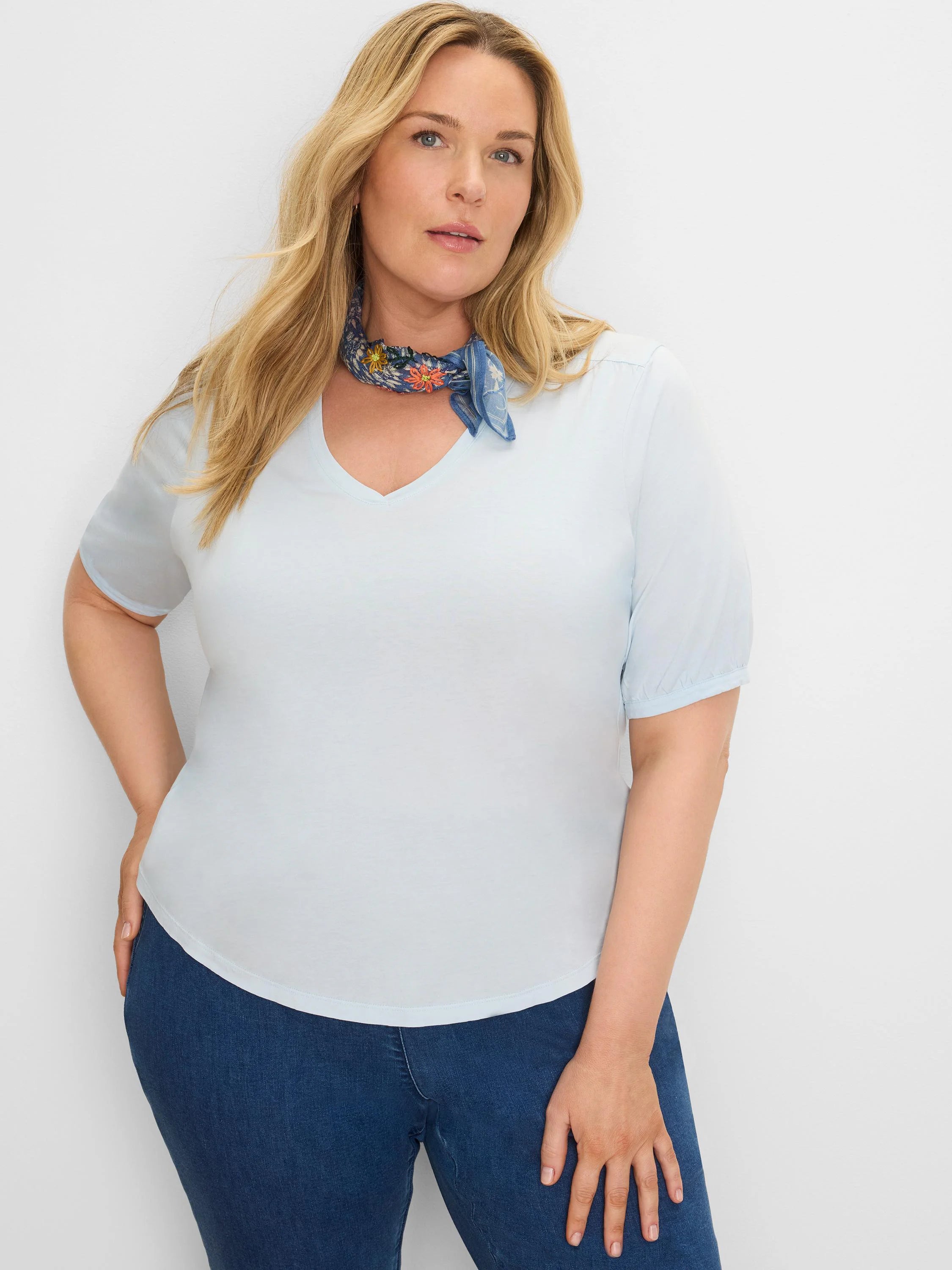 Light blue V-neck elbow sleeve tee with gathered cuffs.
