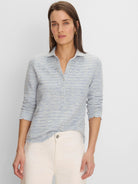 Light blue & white spacedye elbow sleeve polo with collared neck, button placket, and scalloped edges.