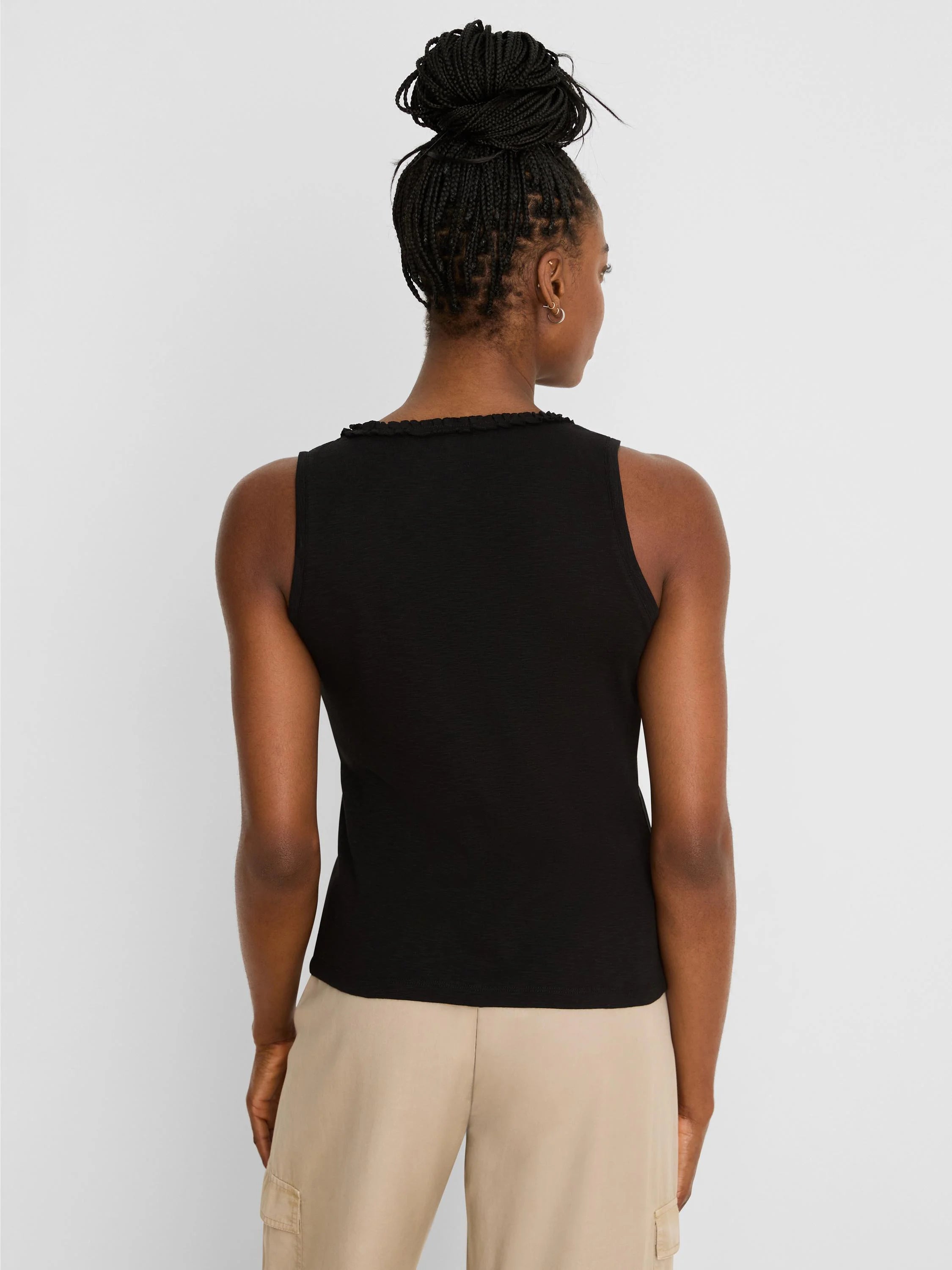 Black cotton slub ruffle neck tank top, viewed from the back on a model.