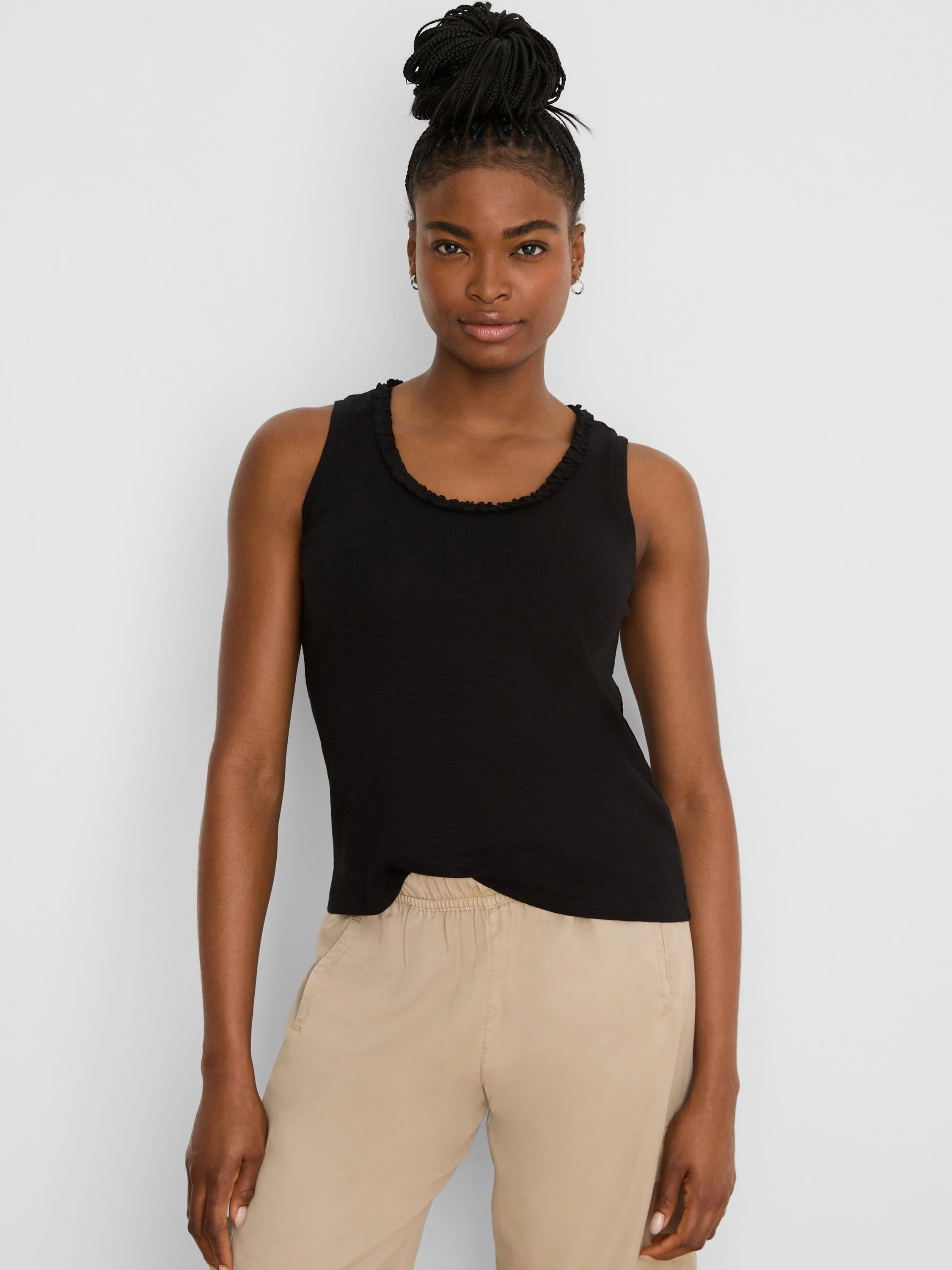 Black cotton slub tank top with a ruffled round neckline.