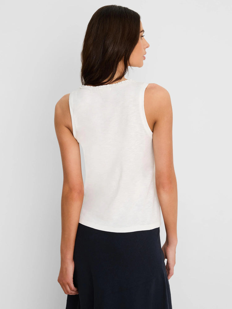 Off-white cotton slub tank top with a ruffle neck, seen from the back on a model.