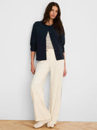 Cream elbow sleeve tee with thin navy stripes and a notch neckline.