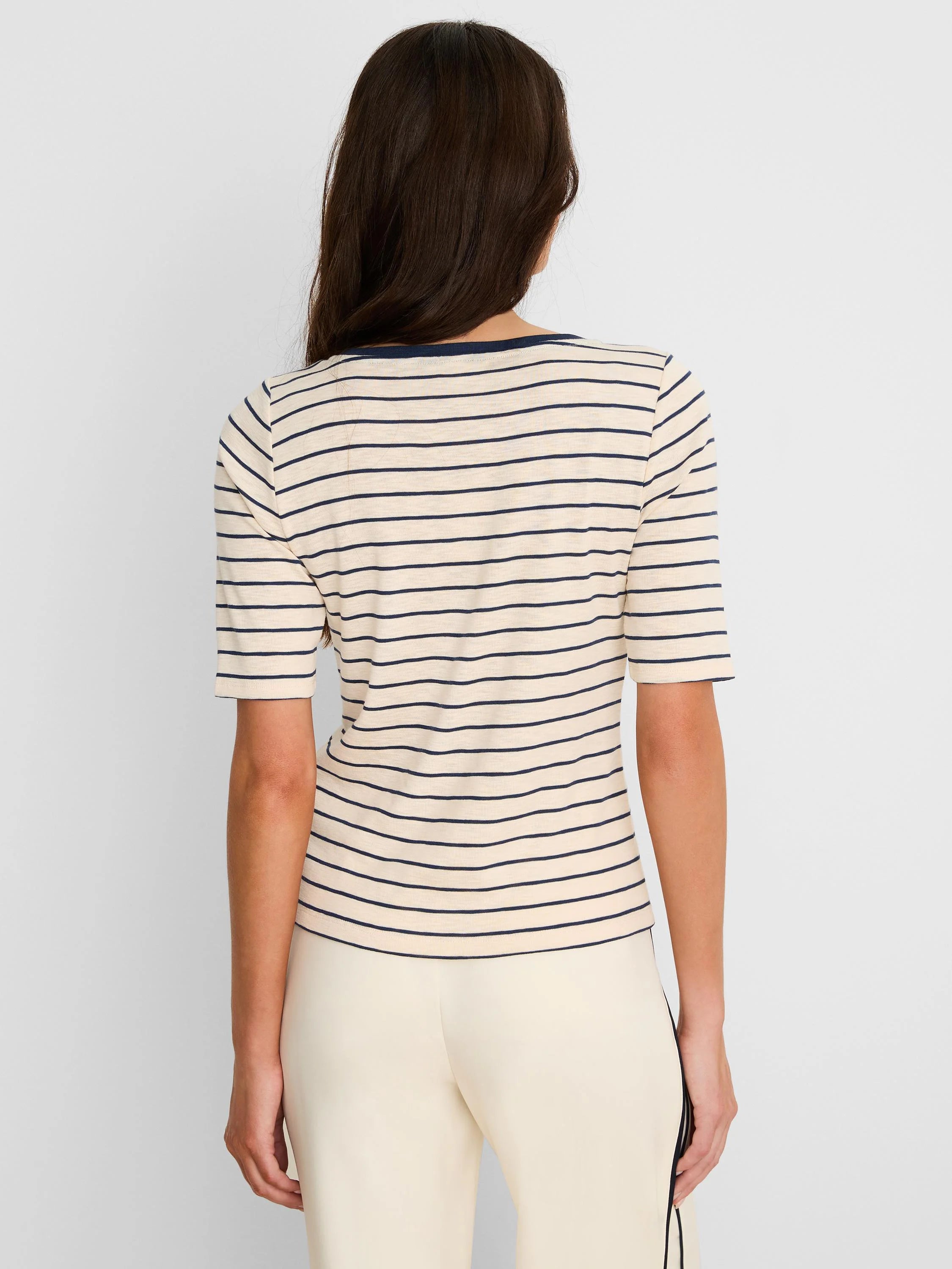 Back view of a cream tee with navy horizontal stripes and elbow-length sleeves.