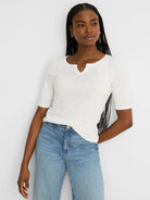 Cream elbow-sleeve tee with a notch neckline and subtle slub knit texture.