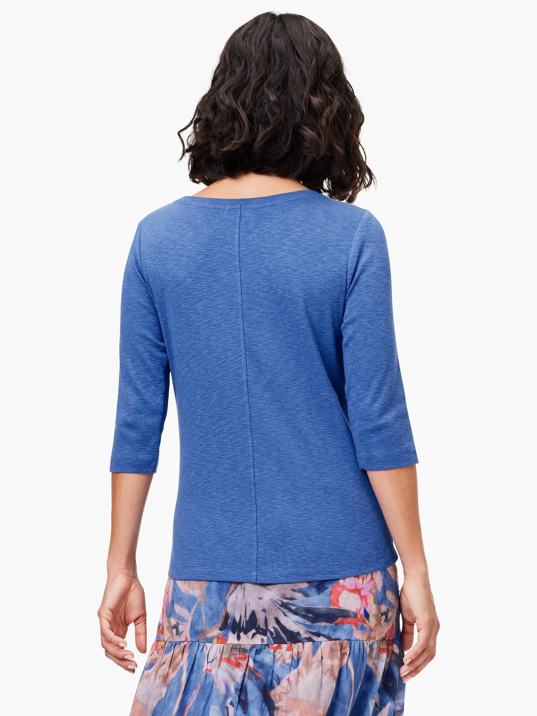 Blue heathered 3/4 sleeve boat neck tee with a vertical seam down the back, worn by a model seen from behind.