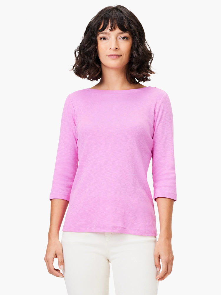 Pink 3/4 sleeve boat neck tee worn by a model.