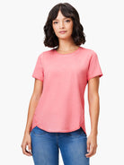 Faded pink short sleeve crew neck tee with a washed texture and curved shirttail hem.